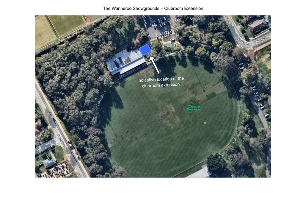 An aerial view of a circular area with trees and buildings

Description automatically generated