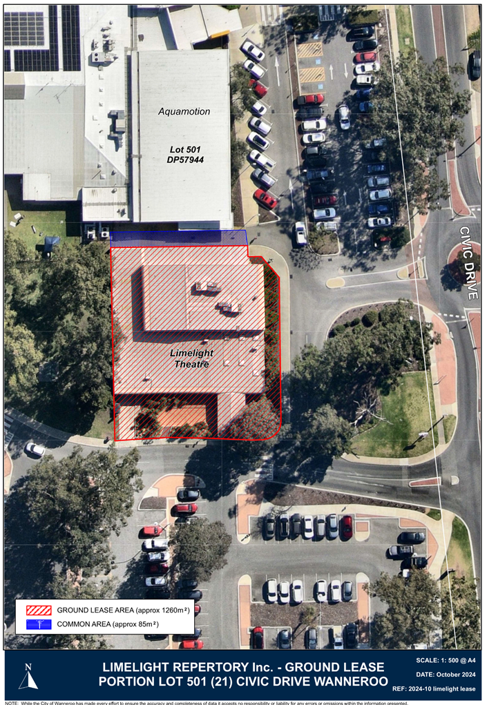 Aerial view of a building with a parking lot

Description automatically generated