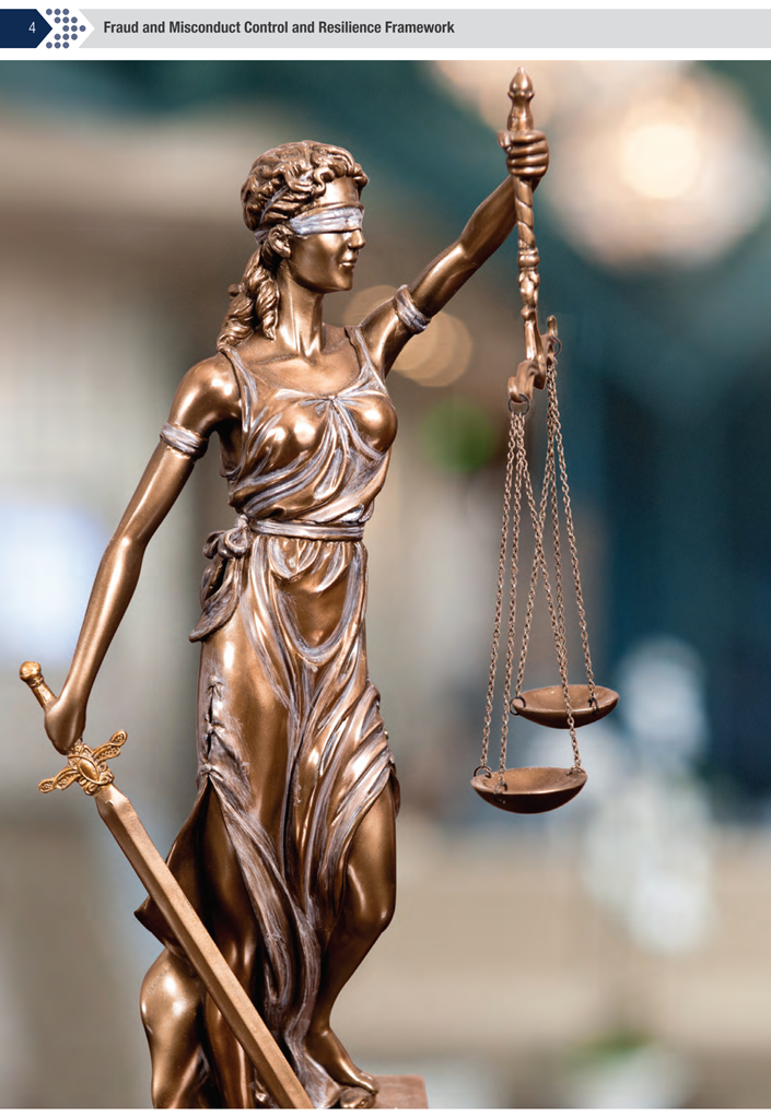 A statue of a person holding a sword and scales

Description automatically generated