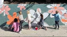 A group of children painting on a wall

AI-generated content may be incorrect.