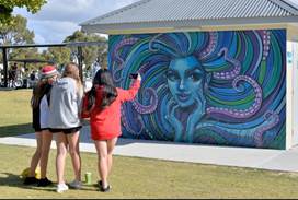 A group of people painting a wall

AI-generated content may be incorrect.