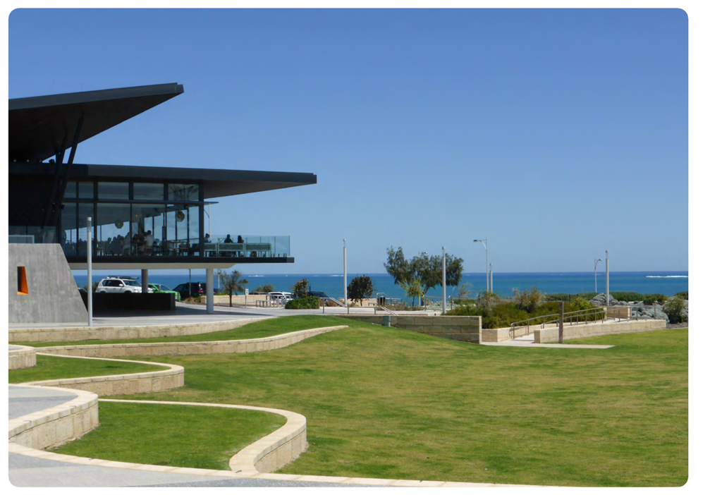 A building with a glass roof and a lawn and a body of water

AI-generated content may be incorrect.